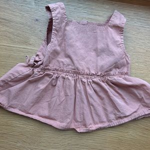 Peplum top with side bows